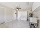 Spacious laundry room with tile floors, storage cabinets, utility sink, and neutral wall color at 1717 Danbury Dr, Sun City Center, FL 33573