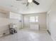 Large laundry room with sink and cabinets at 1717 Danbury Dr, Sun City Center, FL 33573
