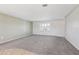 Bright living room with neutral carpet and paint, creating a versatile and inviting space at 1717 Danbury Dr, Sun City Center, FL 33573
