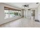 Bright sunroom with a large window offering serene water views, a perfect spot for relaxation at 1717 Danbury Dr, Sun City Center, FL 33573