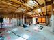 Exposed interior framing of a home under construction, revealing skylights and the potential for a bright, open living space at 1821 Weekend Ln, Odessa, FL 33556