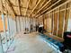 Open interior framing of a space under construction, revealing the structural elements and offering potential for customization and finishing at 1821 Weekend Ln, Odessa, FL 33556