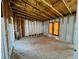 Exposed interior framing of a room under construction, highlighting the structural elements and awaiting customization and finishing touches at 1821 Weekend Ln, Odessa, FL 33556