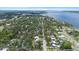 An aerial view of a residential community by the water, showcasing lush greenery, roads and buildings at 1826 2Nd E Ave, Bradenton, FL 34208