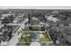 An aerial view of a single Gathering home with a well-manicured yard and a long driveway at 1826 2Nd E Ave, Bradenton, FL 34208