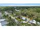 An aerial view of a residential neighborhood with green trees and tidy lawns on a bright sunny day at 1826 2Nd E Ave, Bradenton, FL 34208
