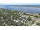 An aerial view of a residential community near the water with lush greenery and well-maintained streets at 1826 2Nd E Ave, Bradenton, FL 34208