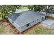 An aerial view shows a well-maintained roof and landscaping surrounding the home at 1826 2Nd E Ave, Bradenton, FL 34208