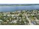 An aerial view of a residential community near the water with lush greenery and well-maintained streets at 1826 2Nd E Ave, Bradenton, FL 34208