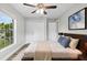 Bright bedroom with a ceiling fan, double closets, and a serene atmosphere at 1826 2Nd E Ave, Bradenton, FL 34208
