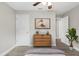 Bedroom showcasing a wood dresser, neutral color scheme, and wood-look floors at 1826 2Nd E Ave, Bradenton, FL 34208