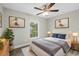 Comfortable bedroom featuring a ceiling fan, natural light, and tasteful decorations at 1826 2Nd E Ave, Bradenton, FL 34208