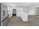 Updated kitchen with stainless steel appliances, white cabinetry and lots of room to move at 1826 2Nd E Ave, Bradenton, FL 34208