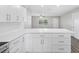 Bright kitchen featuring island, white cabinets, stainless appliances and open concept at 1826 2Nd E Ave, Bradenton, FL 34208