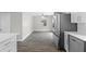 Spacious kitchen featuring stainless steel appliances, hardwood floors, and lots of sunlight at 1826 2Nd E Ave, Bradenton, FL 34208