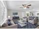 Bright living room with modern furnishings, hardwood floors, and large windows at 1826 2Nd E Ave, Bradenton, FL 34208