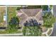 Aerial view of a well-maintained property with a lush green lawn, a fenced backyard, and mature trees at 18339 Fish Loop, Land O Lakes, FL 34638
