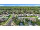 Aerial view of homes in a residential neighborhood surrounded by mature trees at 18339 Fish Loop, Land O Lakes, FL 34638