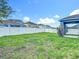 View of the backyard and a white fence at 18339 Fish Loop, Land O Lakes, FL 34638