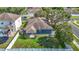 Aerial view of a well-maintained property with a lush green lawn and a fenced backyard at 18339 Fish Loop, Land O Lakes, FL 34638
