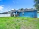 Spacious backyard featuring a well-maintained lawn and privacy fence at 18339 Fish Loop, Land O Lakes, FL 34638