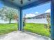 Backyard featuring a patio and green lawn, surrounded by a white fence at 18339 Fish Loop, Land O Lakes, FL 34638