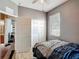 Cozy bedroom featuring neutral walls, wood-look flooring, ceiling fan, and closet at 18339 Fish Loop, Land O Lakes, FL 34638