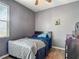 Comfortable bedroom with bed, ceiling fan, and decor at 18339 Fish Loop, Land O Lakes, FL 34638