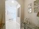 Bright hallway with decorative mirrors and neutral-toned walls at 18339 Fish Loop, Land O Lakes, FL 34638