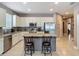 Kitchen with a kitchen island featuring granite countertops, stainless steel appliances, and a subway tile backsplash at 18339 Fish Loop, Land O Lakes, FL 34638