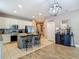 Kitchen with a kitchen island featuring granite countertops, stainless steel appliances, and opens to the living area at 18339 Fish Loop, Land O Lakes, FL 34638