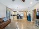 Open-concept living room with a kitchen island and pendant lighting provides a functional design at 18339 Fish Loop, Land O Lakes, FL 34638