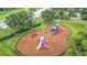 Overhead view features a colorful community playground with slides, climbing structures and cushioned ground cover at 18339 Fish Loop, Land O Lakes, FL 34638
