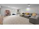 Bright living room with neutral carpet and lots of space for entertaining at 19259 Mossy Pine Dr, Tampa, FL 33647