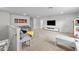 Spacious living room offers lots of natural light and neutral carpet floors at 19259 Mossy Pine Dr, Tampa, FL 33647
