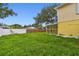 Fenced in backyard with covered patio at 1972 Lansing Dr, Clearwater, FL 33763