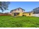 Two-story home with backyard and covered patio at 1972 Lansing Dr, Clearwater, FL 33763