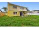 Two-story home with a covered patio and spacious backyard at 1972 Lansing Dr, Clearwater, FL 33763