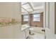The bathroom features a sink, toilet, tub, and shower combination at 1972 Lansing Dr, Clearwater, FL 33763