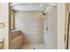 Tiled walk-in shower featuring a showerhead and built-in seating at 1972 Lansing Dr, Clearwater, FL 33763
