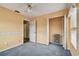 A bedroom with an open closet and a connecting bathroom at 1972 Lansing Dr, Clearwater, FL 33763