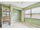 Bedroom featuring a ceiling fan, a window and closet, providing comfort and ample storage space at 1972 Lansing Dr, Clearwater, FL 33763