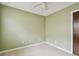 Bedroom featuring a ceiling fan, neutral paint, and natural light, creating a relaxing atmosphere at 1972 Lansing Dr, Clearwater, FL 33763