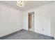 Empty carpeted room featuring natural light from a window and an ornate ceiling light at 1972 Lansing Dr, Clearwater, FL 33763