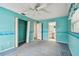 A carpeted bedroom with a ceiling fan and ensuite bathroom access at 1972 Lansing Dr, Clearwater, FL 33763