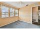 A bedroom featuring three windows with blinds at 1972 Lansing Dr, Clearwater, FL 33763