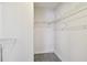 Walk-in closet featuring shelving and carpet flooring at 1972 Lansing Dr, Clearwater, FL 33763