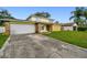 Spacious driveway leading to a two-car garage and charming home at 1972 Lansing Dr, Clearwater, FL 33763