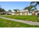 Traditional two-story home with a well-maintained lawn at 1972 Lansing Dr, Clearwater, FL 33763
