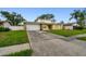 Charming home with a two-car garage and a well-manicured lawn at 1972 Lansing Dr, Clearwater, FL 33763